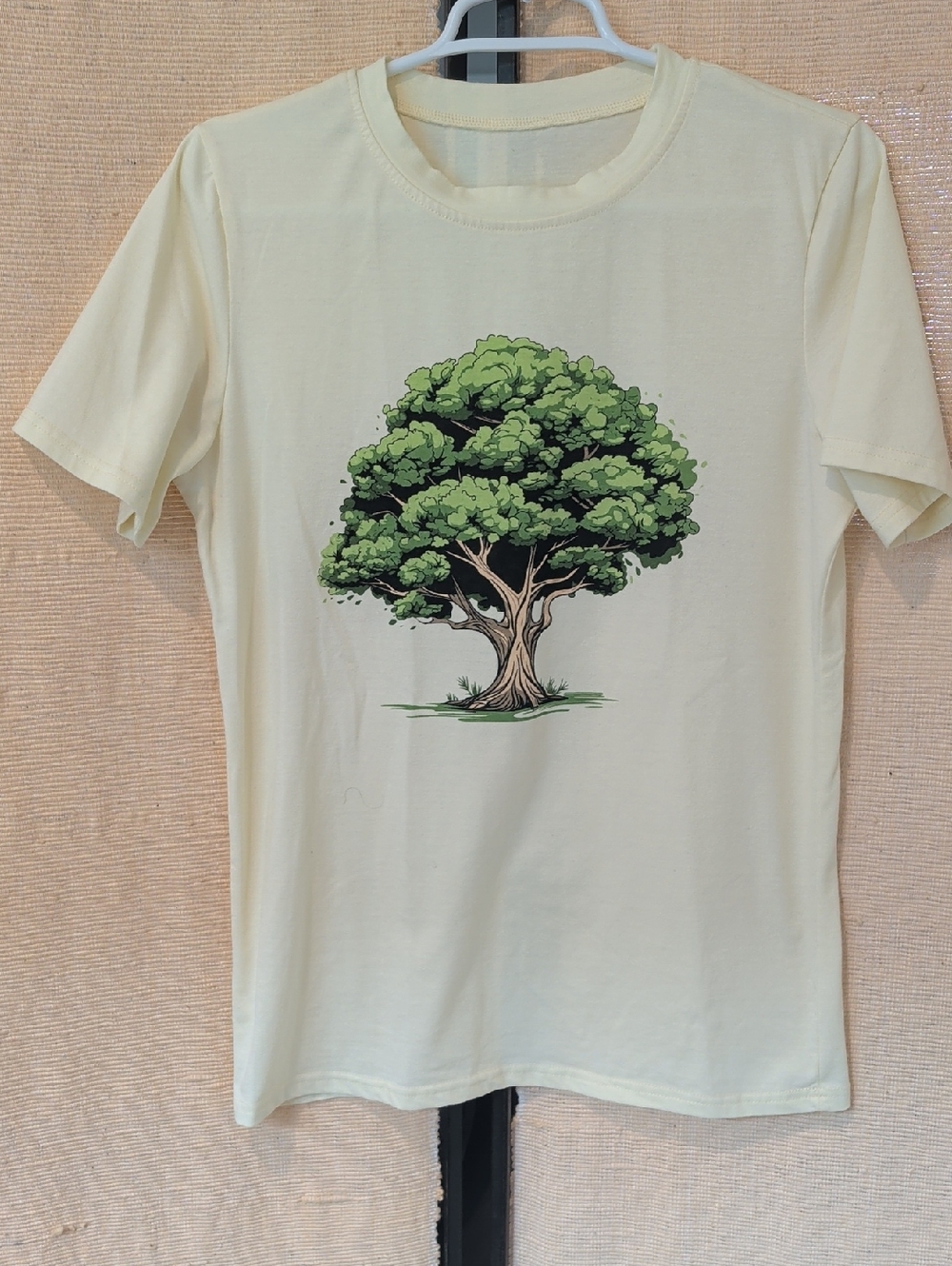 Amazon Cream Short Sleeve Tee with Green Tree Graphic